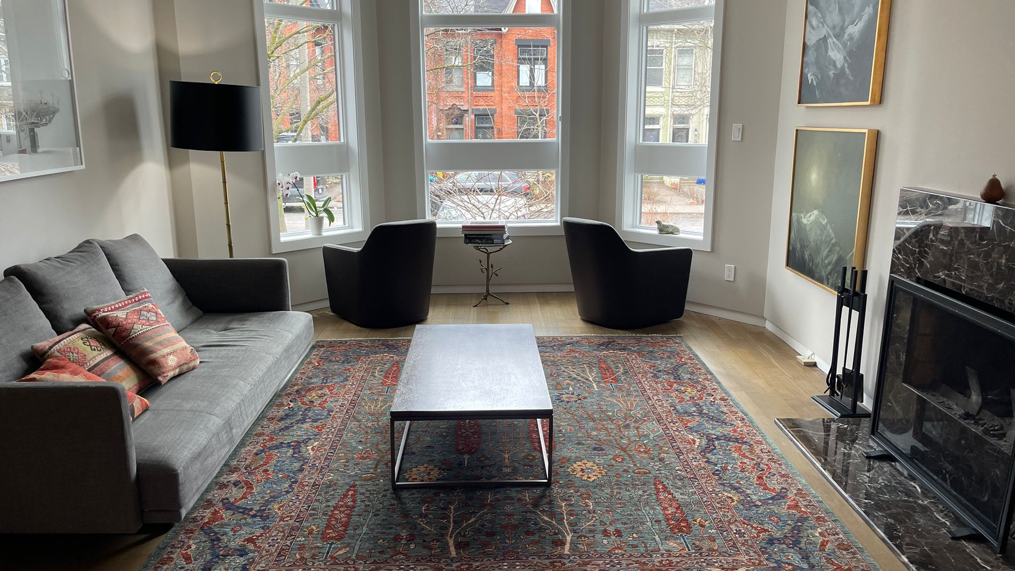 A handwoven Anatolian rug in a bright, elegant living room